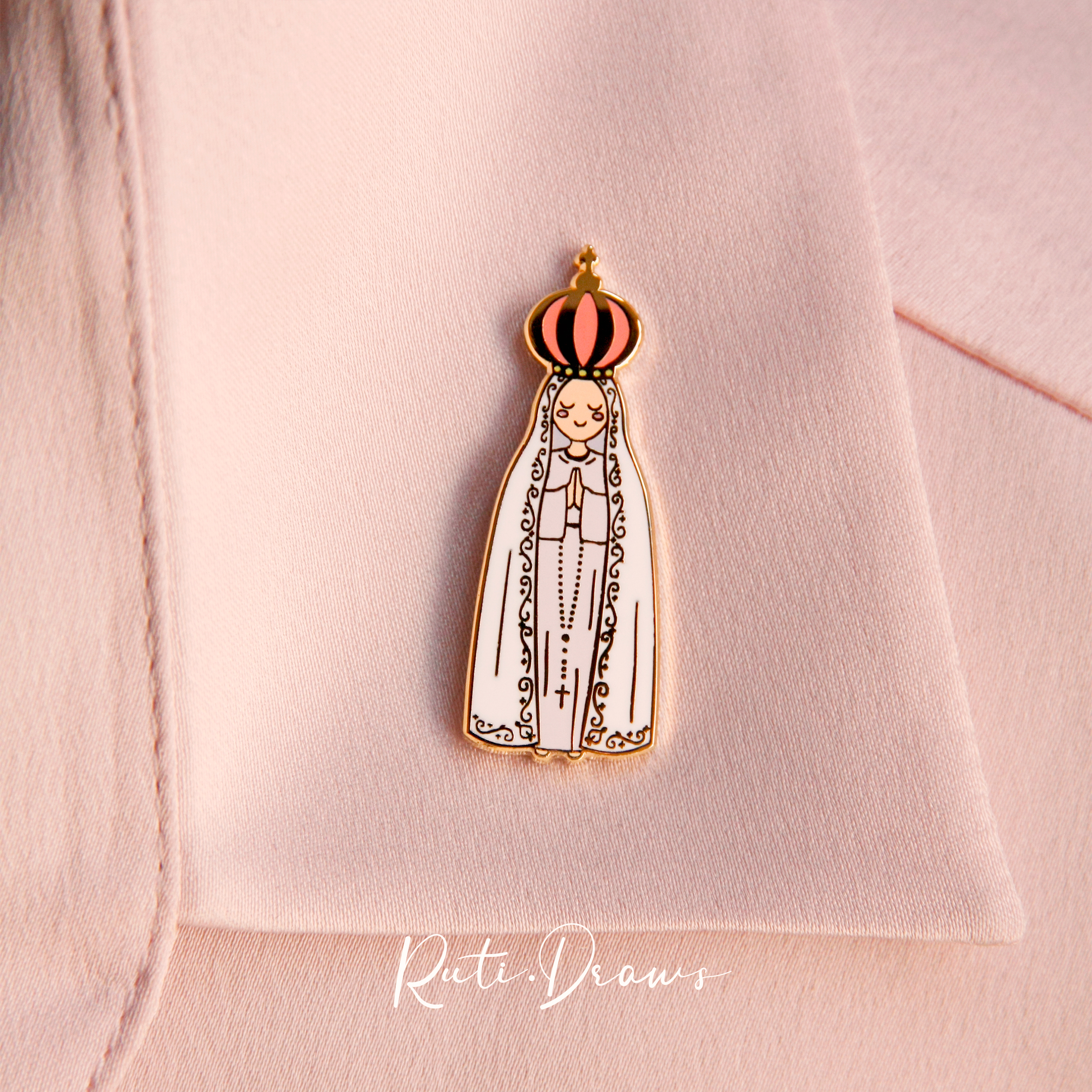 Close-up of the Our Lady of Fatima pin
