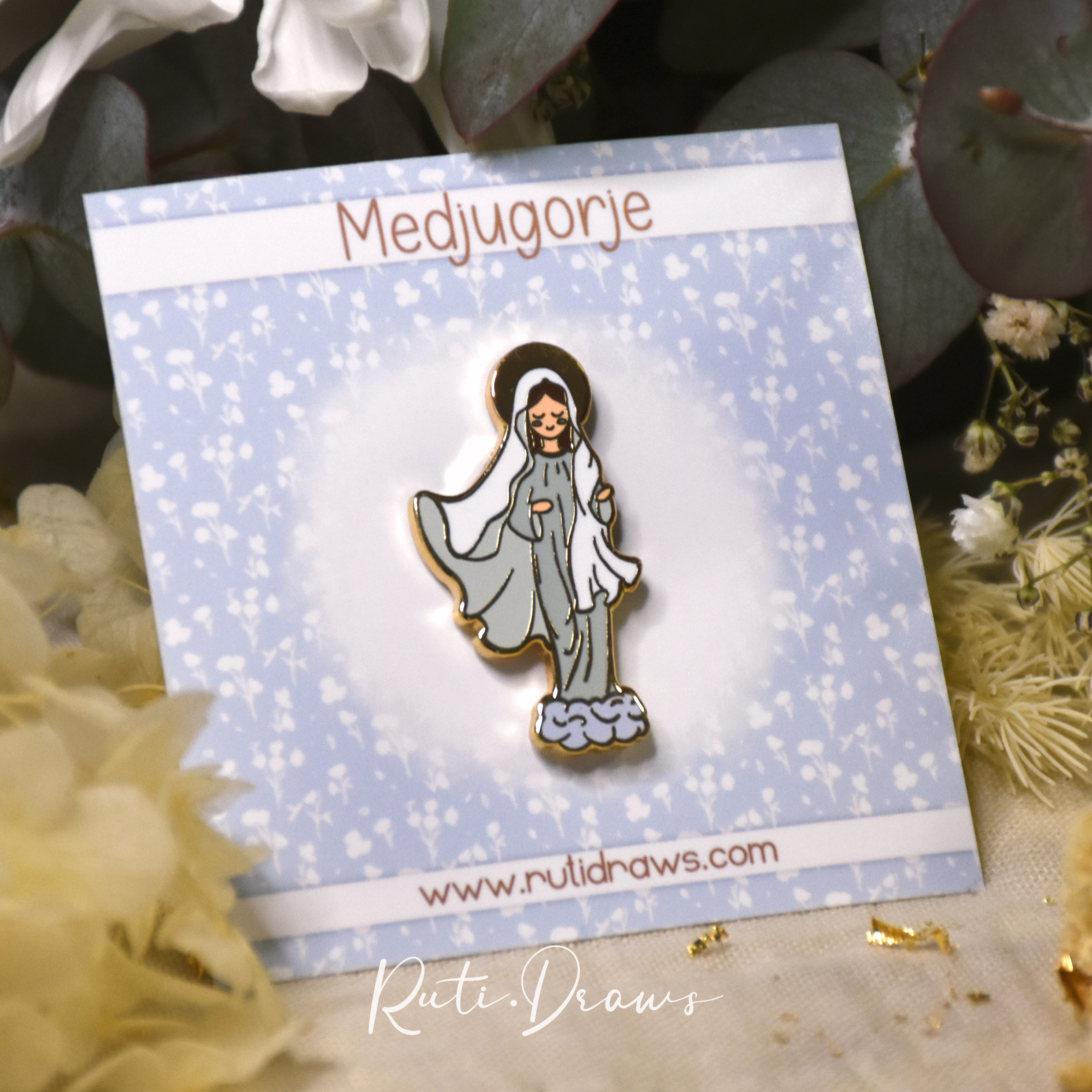 Close-up of the Our Lady of Medjugorje pin